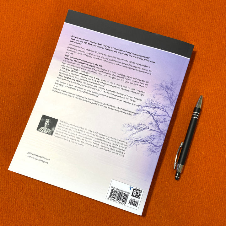 Awaken_Your_Introvert_Strengths_Self-Coaching_Journal back cover with a pen on an orange surface