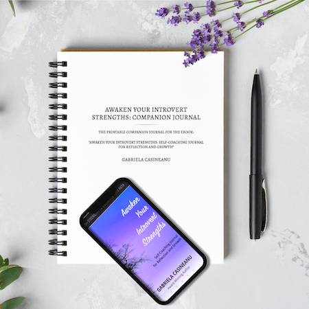 Companion Journal for "Awaken Your Introvert Strengths Journal" (ebook) with smartphone displaying book cover, pen, and lavender flowers on a light surface