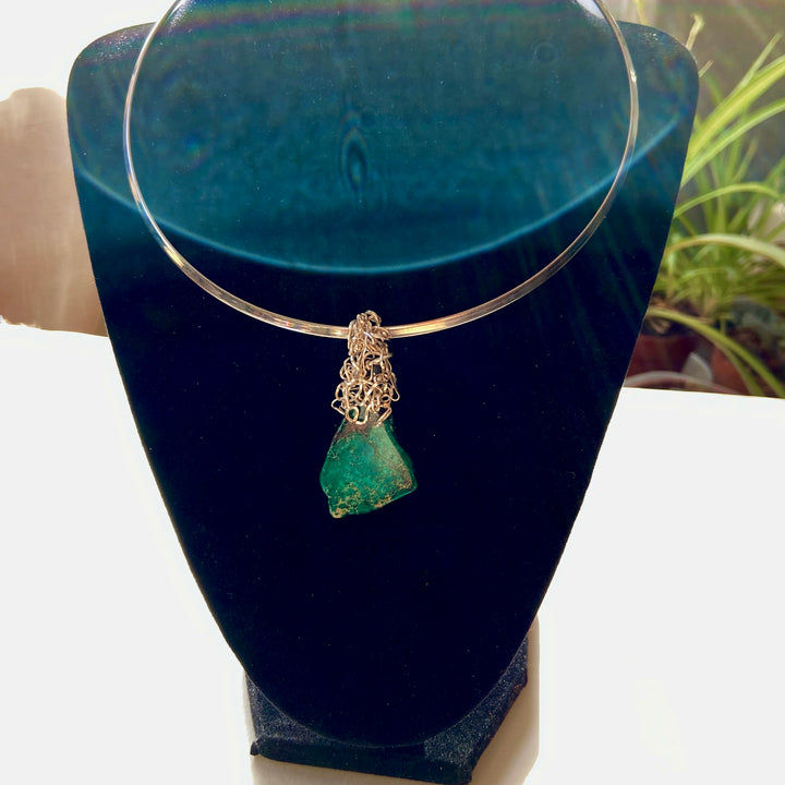 Necklace with a Green Jasper stone pendant wire-wrapped  on a back display