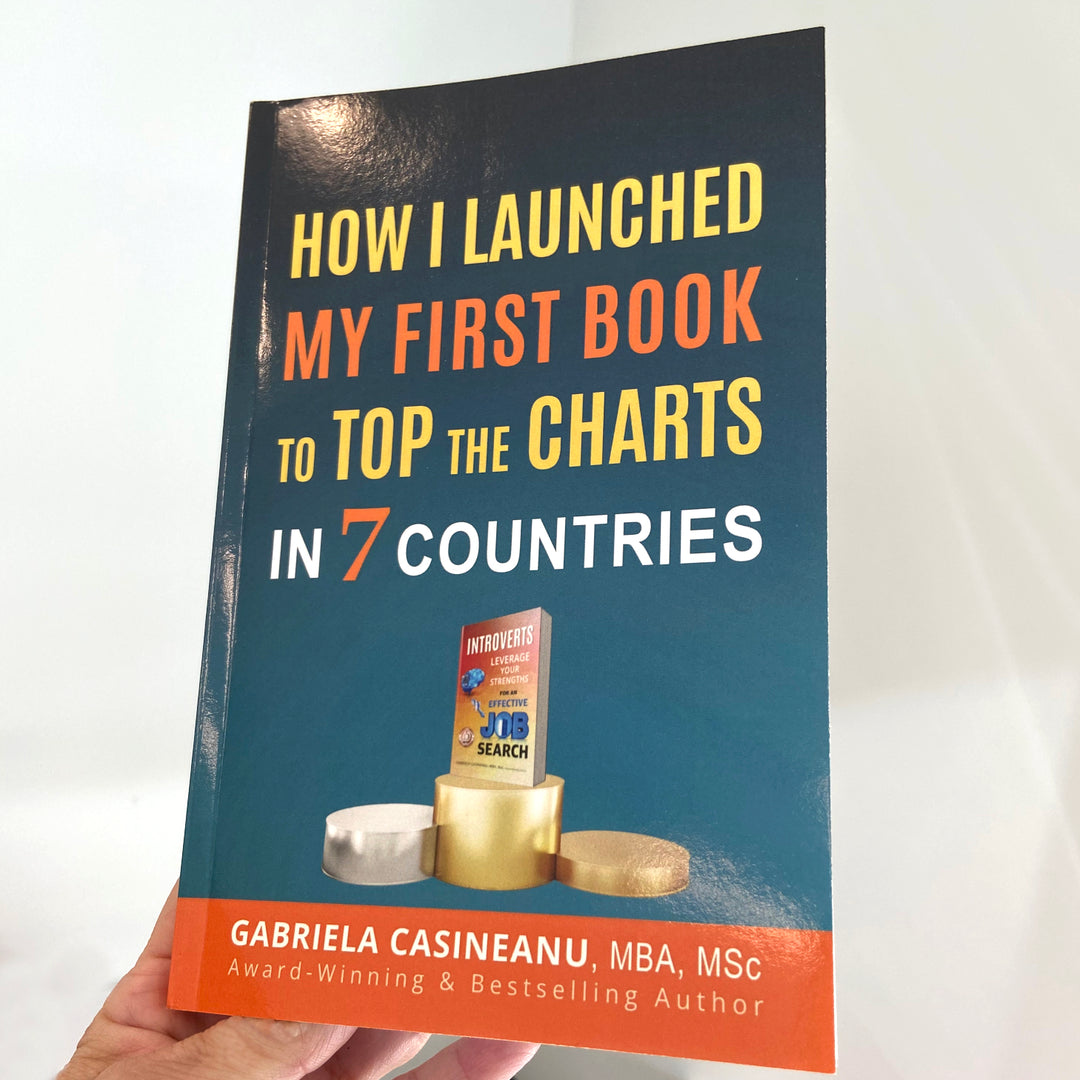 Image with a hand holding the book How I Launched My First Book to Top the Charts in 7 Countries