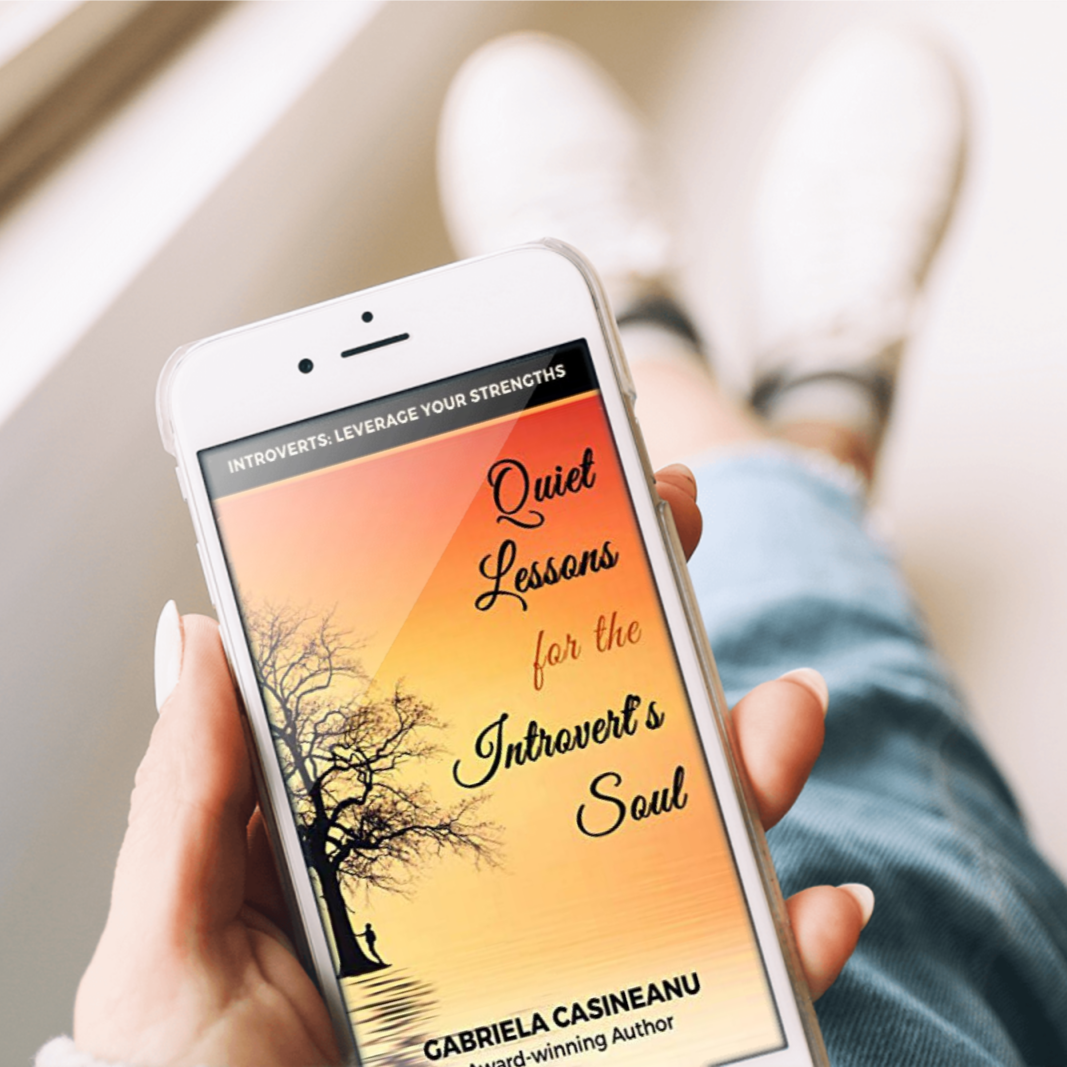  'Quiet Lessons for the Introvert’s Soul' hand with phone ebook