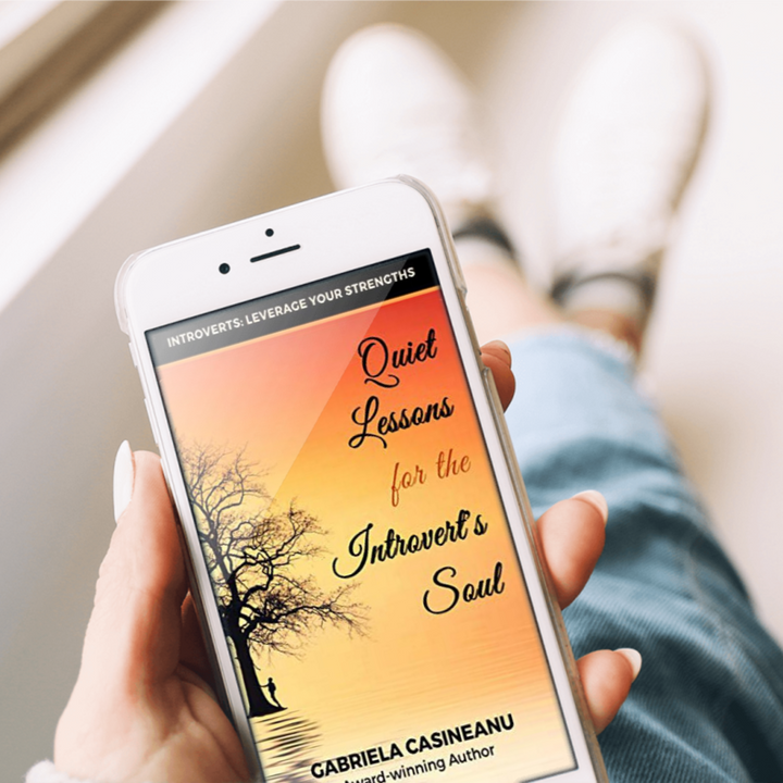  'Quiet Lessons for the Introvert’s Soul' hand with phone ebook