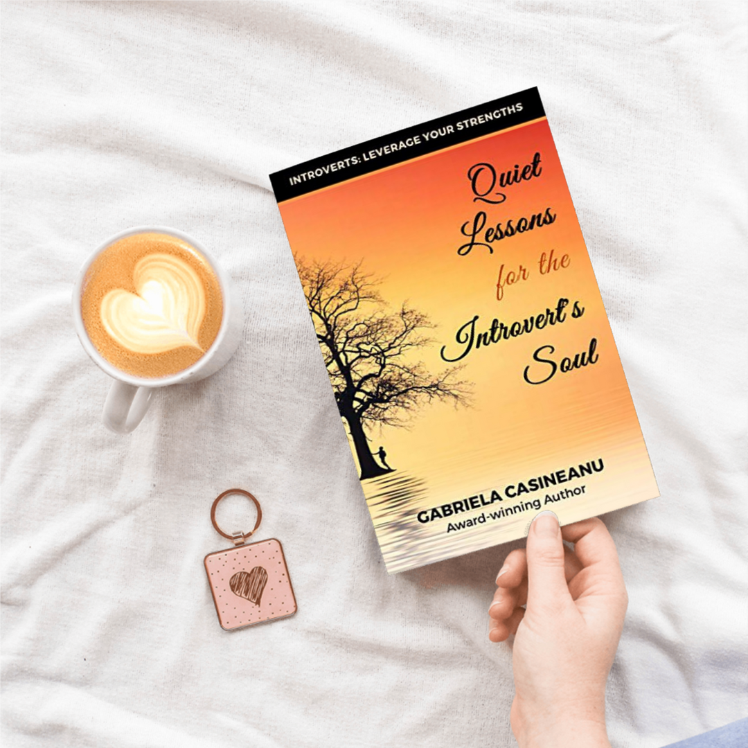 book Quiet Lessons for the Introvert’s Soul hold in hand near a coffee cup