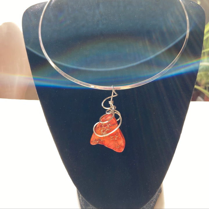 Necklace with a orange Jasper stone pendant silver-plated spiral on a black velvet stand